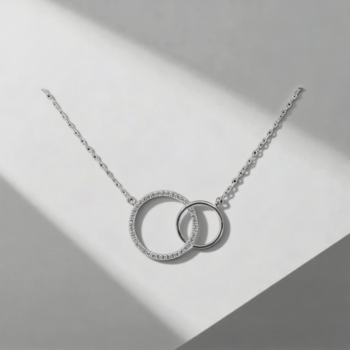 Close-up showing sparkling CZ stones on interlocking circles