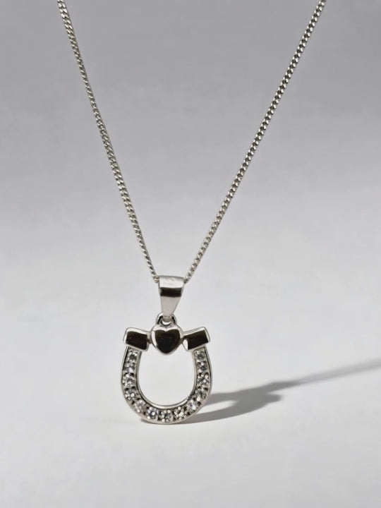 Luxury packaging of RAFYQ Silver CZ Lucky Horse Shoe & Heart Pendant