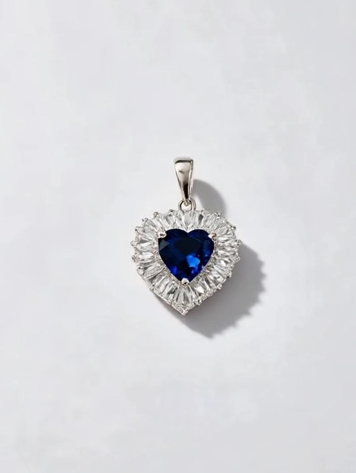 Close-up showing sapphire center with sparkling CZ stones