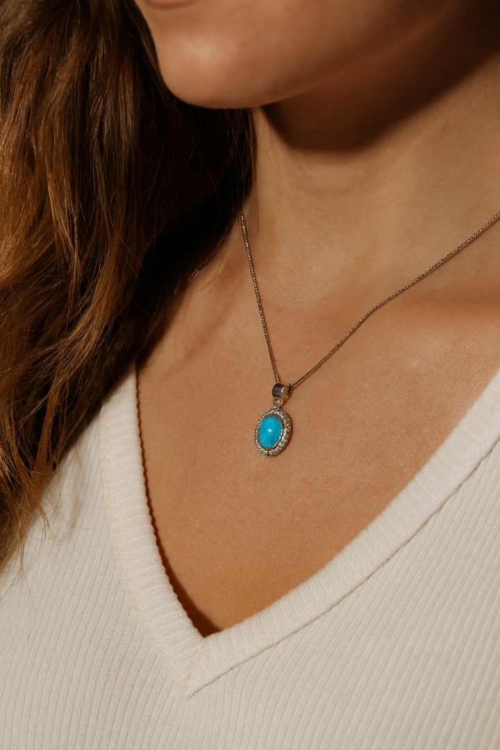 Pendant reflecting light showing sparkling CZ and opal